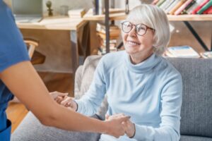 woman holding hands with caregiver