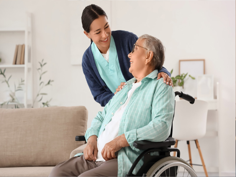 elderly woman with senior caregiver