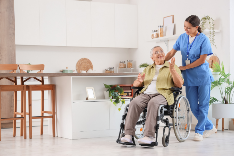 Elderly woman in a wheelchair with professional caregiver post-hospitalization